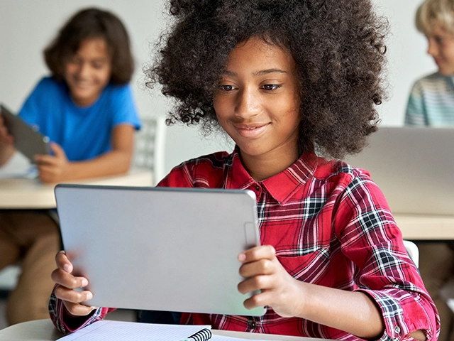 Girl-Middle-School-Student-Tablet-Sitting-640x480